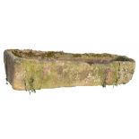 AN ENGLISH SANDSTONE TROUGH, 19TH C slightly tapered, a drain hole at one end, 40cm h; 60 x 182cm (