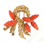 A KUTCHINSKY CARVED CORAL AND 18CT GOLD BROOCH, 1989 4.9cm, signed, London hallmark, 28g ++