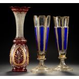 A PAIR OF FRENCH OR BOHEMIAN BLUE AND GILT OVERLAY GLASS VASES AND A RUBY FLASHED AND GILT GLASS