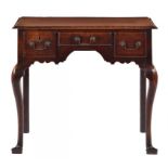 A GEORGE III OAK AND CROSSBANDED LOWBOY, C1780 on cabriole forelegs, 74cm h; 42 x 82cm ++Top with