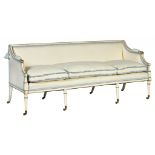 A GEORGE III WHITE AND GILT PAINTED BEECH SOFA, C1800 with swept arms, on eight tapered legs and