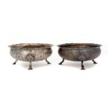 A PAIR OF GEORGE V SILVER BOWLS of embossed and beaded form on hoof feet, 13cm diam, by Thomas