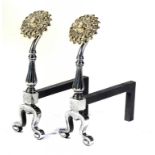 A PAIR OF AESTHETIC STYLE BURNISHED STEEL AND BRASS SUNFLOWER FIRE DOGS, C1900 48cm h, with later