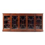 A VICTORIAN MAHOGANY BREAKFRONT BOOKCASE, C1900 fitted with adjustable shelves enclosed by five