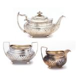 A GEORGE III SILVER TEAPOT AND A MATCHING VICTORIAN CREAM JUG AND SUGAR BOWL teapot 14.5cm h, by