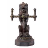 HEARTH FURNITURE. A VICTORIAN BRASS MOUNTED CAST IRON LION IMPLEMENT REST, C1870 on octagonal