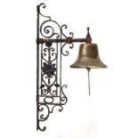 A VICTORIAN WROUGHT IRON WALL BRACKET AND BRASS BELL, C1900 wall plate 50cm h ++Old rust and tarnish