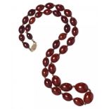 A NECKLACE OF 36 PRESSED (RECONSTITUTED) AMBER BEADS, C1930 47g ++++