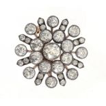 A VICTORIAN DIAMOND BROOCH-PENDANT, C1900 with larger central round old cut diamond in gold, 2.7cm