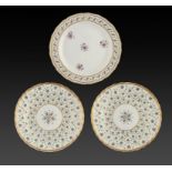 ONE AND A PAIR OF DERBY PLATES, C1800 enamelled with formal patterns of stylised flowers, 22.5 and