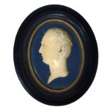 A CARVED IVORY PORTRAIT RELIEF OF THE HEAD OF A MAN, 19TH C 9.5cm h, mounted, in ebonised frame with