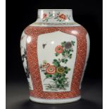 A CHINESE FAMILLE VERTE JAR, 19TH/EARLY 20TH C painted with four panels of lotus, peony,
