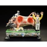 A STAFFORDSHIRE EARTHENWARE TABLE BASED BULL BAITING GROUP, CIRCA LATE 19TH C 13.5cm h ++Restoration