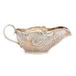 A SCOTTISH VICTORIAN SILVER SAUCE BOAT with reeded handle, 20cm l, by R & W Sorley, Glasgow 1894,