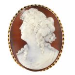 A CAMEO BROOCH, LATE 19TH C the shell carved with the head of a bacchante, 5.7cm h ++In fine