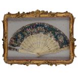A CHINESE IVORY BRISÉ FAN, CANTON, C1830 the guards and sticks intricately carved with scenes, the