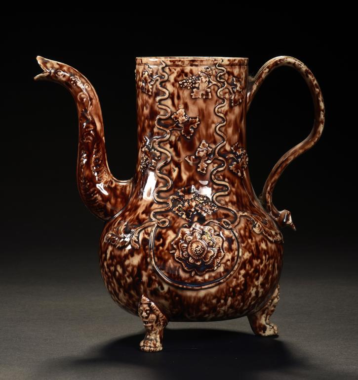 A STAFFORDSHIRE TORTOISESHELL GLAZED CREAMWARE COFFEE POT, C1760 derived from a saltglazed stoneware