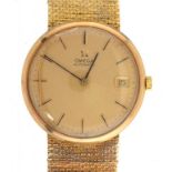 AN OMEGA 9CT GOLD SELF WINDING GENTLEMAN'S WRISTWATCH with date, 3.3cm diam, tapered mesh bracelet