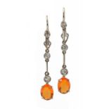 A PAIR OF DIAMOND AND FIRE OPAL EARRINGS in white gold, fully articulated, wire loops, 4.5cm, 3.