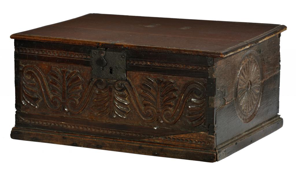 A CHARLES II BOARDED OAK DESK BOX, LATE 17TH C the chip carved front centred by leaves and S