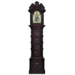 A VICTORIAN CARVED OAK EIGHT DAY LONGCASE CLOCK, C1900 the breakarched and foliate engraved brass