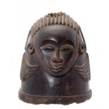 TRIBAL ART. A HELMET MASK, IGALA PEOPLE, NIGERIA, 19TH/20TH C of carved and smoothed, stained