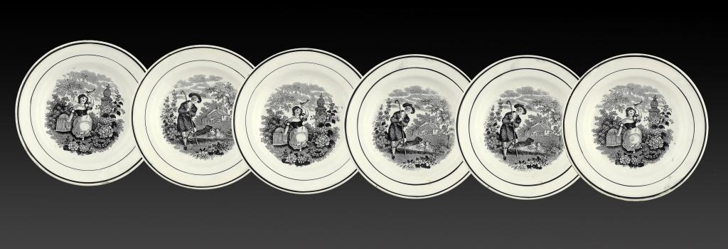 A SET OF SIX BRITISH WHITE EARTHENWARE CHILDREN'S PLATES, C1840 printed in black with a young