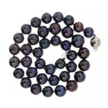 A BLACK CULTURED PEARL NECKLACE of thirty nine cultured pearls ranging from 1.1 - 1.4cm, white