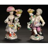 A PAIR OF DERBY FIGURES OF A SEATED BOY AND GIRL WITH FLOWERS, C1830 12cm h, crossed swords ++