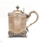 A VICTORIAN SILVER MUSTARD POT of tankard form, crested, blue glass liner, 9cm h, by John Evans,