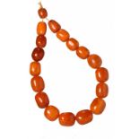 A NECKLACE OF 18 AMBER BEADS 137g ++++