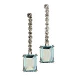 A PAIR OF AQUAMARINE AND DIAMOND EARRINGS with an articulated line of diamond collets and larger