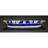 A COALPORT SCALE BLUE GROUND PEN TRAY, C1815 with gilt eagle handles and painted with reserves of