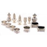 ONE, A PAIR AND SET OF FOUR SILVER SALT CELLARS AND FOUR AND A PAIR OF SILVER PEPPER CASTERS various