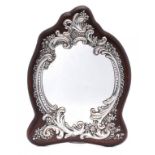 A VICTORIAN SILVER ROCOCO REVIVAL MIRROR backed on mahogany, 40cm h, maker's mark poorly struck,