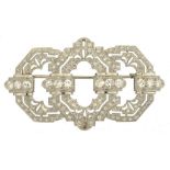 AN ART DECO DIAMOND BROOCH, C1940 millegrain set in white gold, 5.6cm l, 15.6g ++In good condition