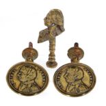 ,A PAIR OF REGENCY NELSON COMMEMORATIVE BRASS CURTAIN STAYS OR DOOR KNOBS, C1798 embossed with a