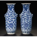 A PAIR OF CHINESE BLUE AND WHITE VASES, 18TH C with lotus meander and lappets, 25cm h ++Slight