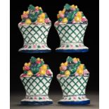 A SET OF FOUR WHITE EARTHENWARE FLOWER BASKET WINDOW- WEDGES, C1820-40 painted in bright enamels