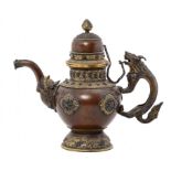 A TIBETAN PARCEL GILT COPPER ALLOY CEREMONIAL TEAPOT AND COVER, 19TH C with zoomorphic handle and