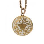 ROYAL. A VICTORIAN GOLD AND WHITE ENAMEL MOURNING LOCKET the front with royal crown and scrolling