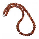 A NECKLACE OF 61 AMBER BEADS 21g ++++