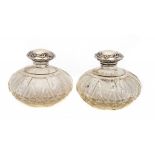 TWO MATCHING EDWARD VII AND GEORGE V SILVER MOUNTED CUT GLASS SCENT BOTTLES with faceted glass