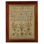 A VICORIAN LINEN SAMPLER BY ANN MURDIN AGED 8 YEARS, 1855 worked with various motifs framing the