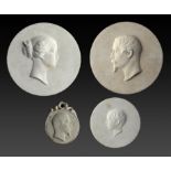THREE SÈVRES BISCUIT PORTRAIT MEDALLIONS OF THE EMPEROR NAPOLEON III, EMPRESS EUGENE AND THE