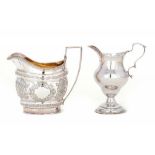 TWO GEORGE III SILVER CREAM JUGS ogee and oval, the latter later chased, 10.5 & 11cm h, both London,