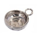 A FRENCH SILVER WINE TASTER the bowl stamped with the initial M and engraved with AUDIGE, chased