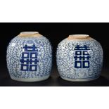 TWO CHINESE BLUE AND WHITE GINGER JARS, EARLY 19TH C painted with prominent shou characters and
