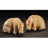 A PAIR OF SOUTH EAST ASIAN IVORY CARVINGS OF HIPPOPOTOMI, 19TH C 6.5cm h ++Old crack and yellowing