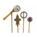 FOUR GEM SET GOLD STICK PINS, EARLY 20TH C the terminals in the form of a tennis racquet, fleur de